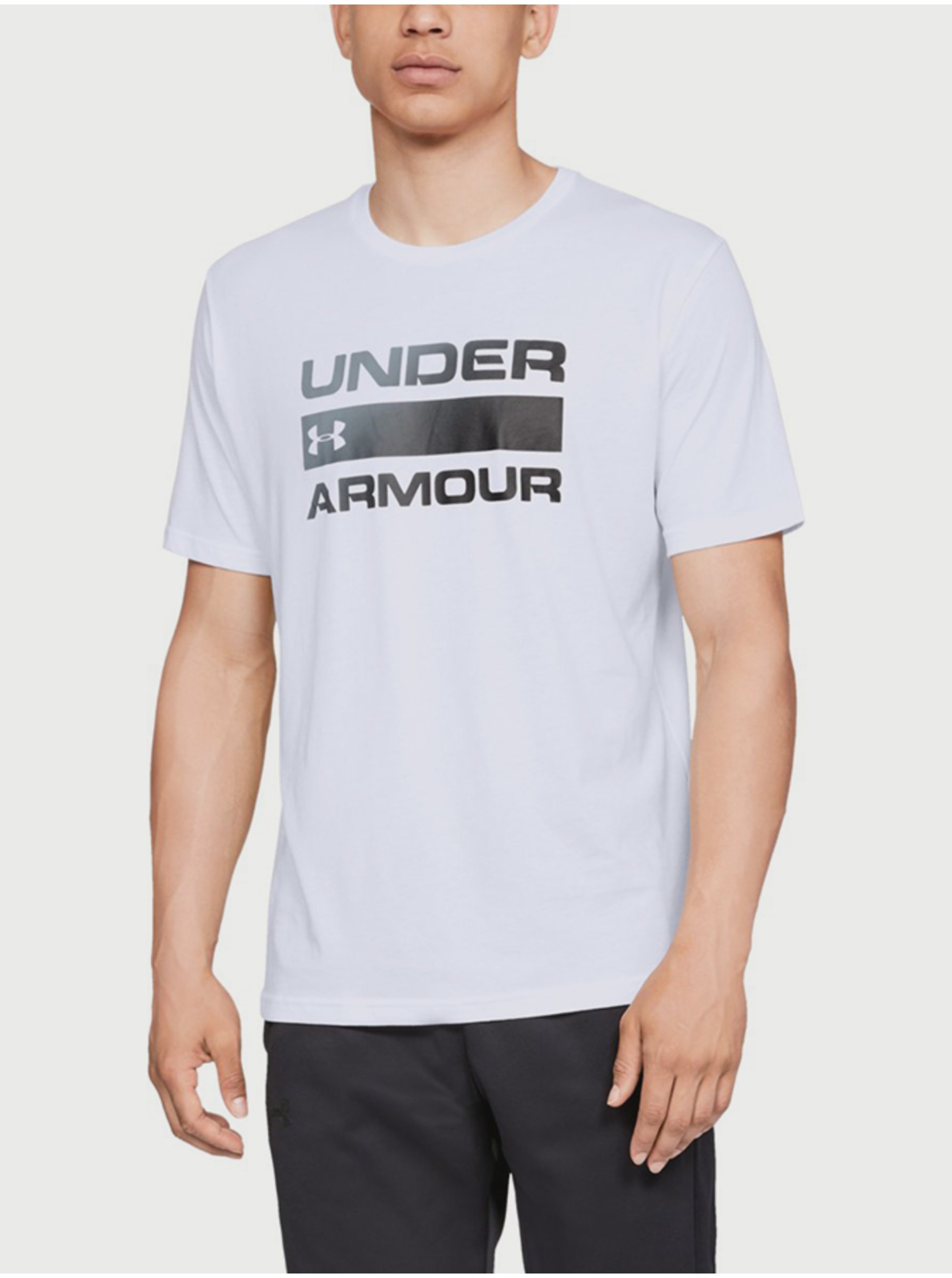 Levně Bílé pánské tričko Team Issue Wordmark Under Armour