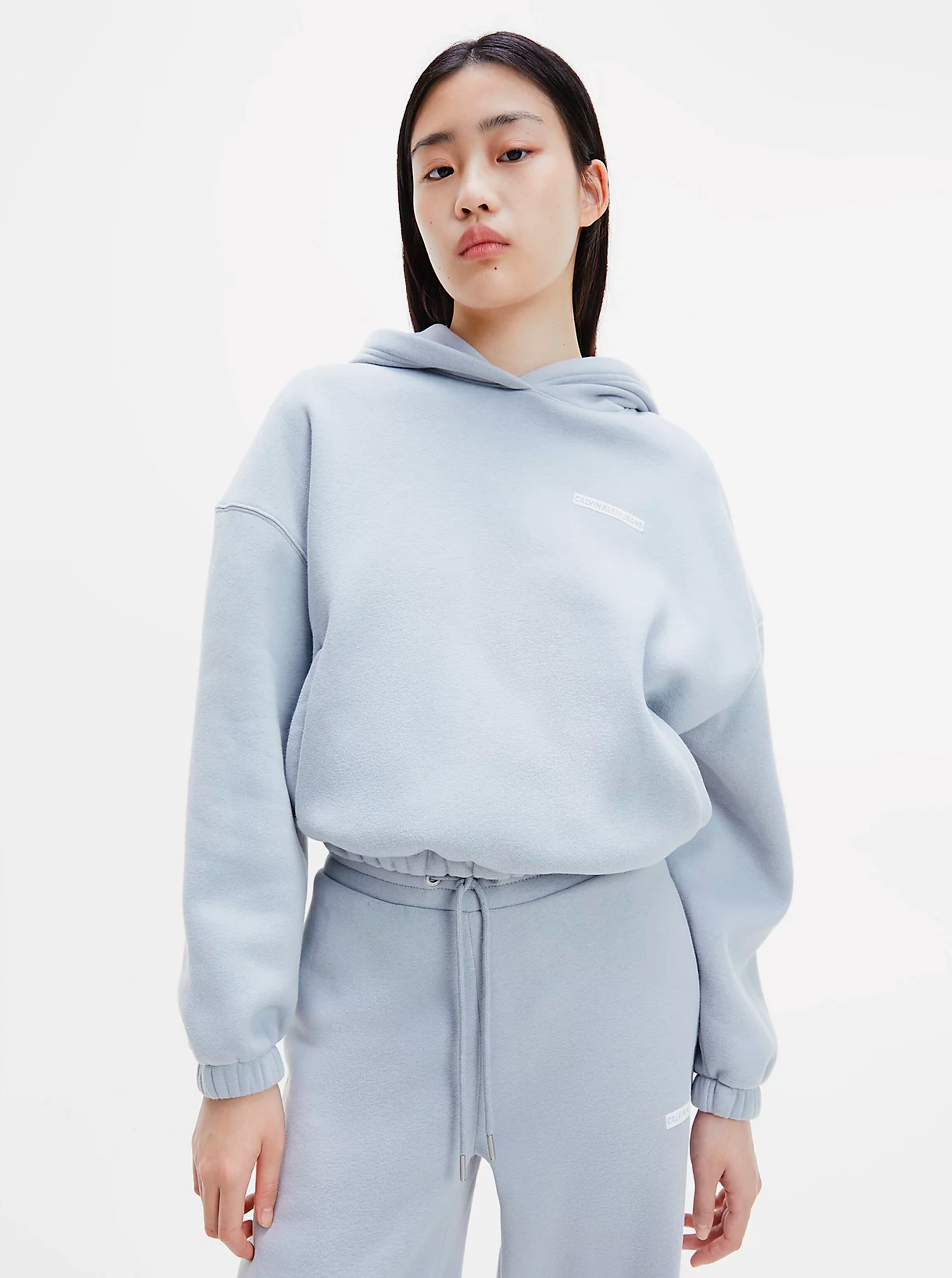 E-shop Světle modrá dámská mikina s kapucí Micro Flock Hoodie Calvin Klein Jeans