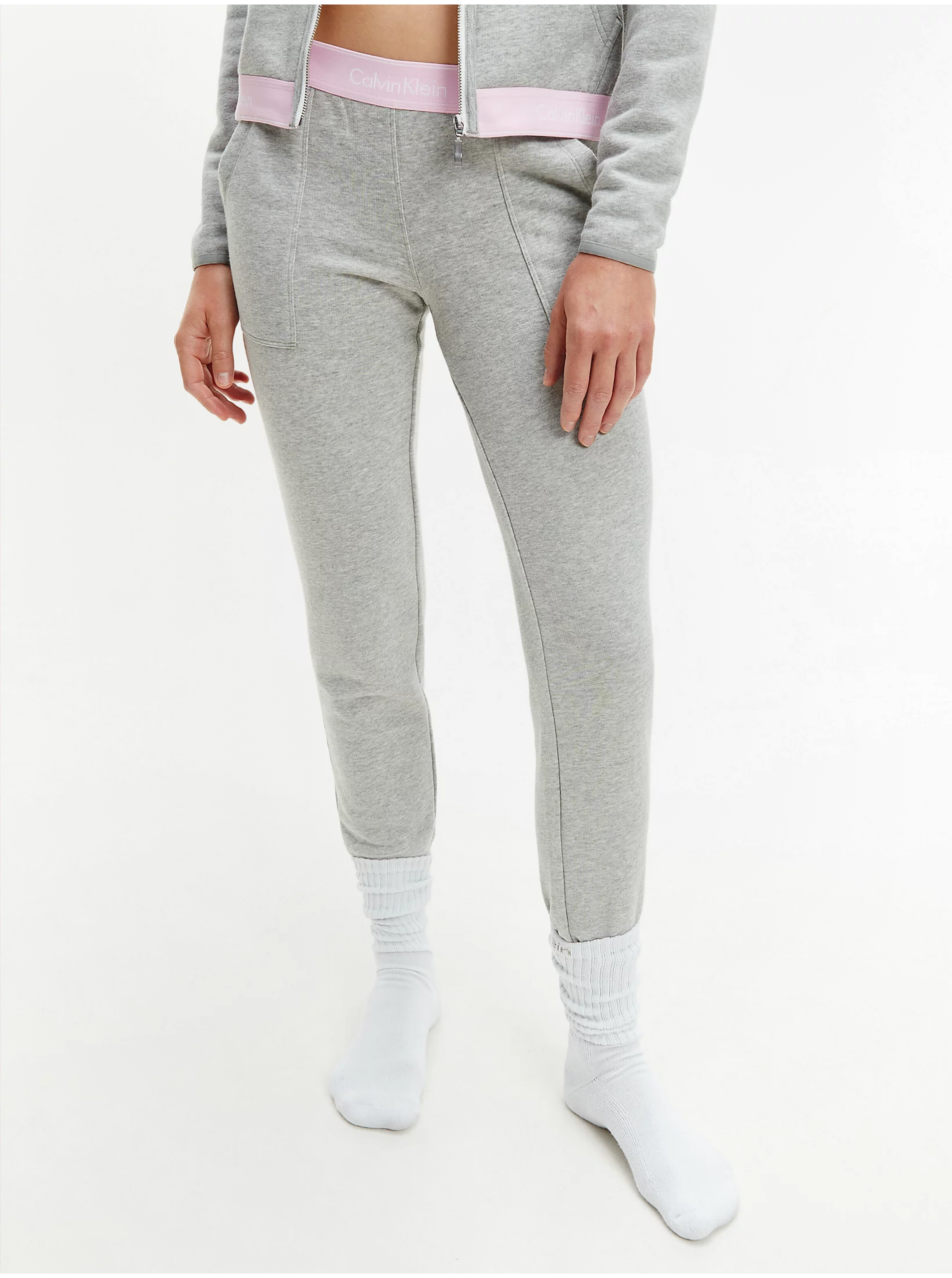 E-shop Šedé dámské žíhané tepláky Calvin Klein Jeans