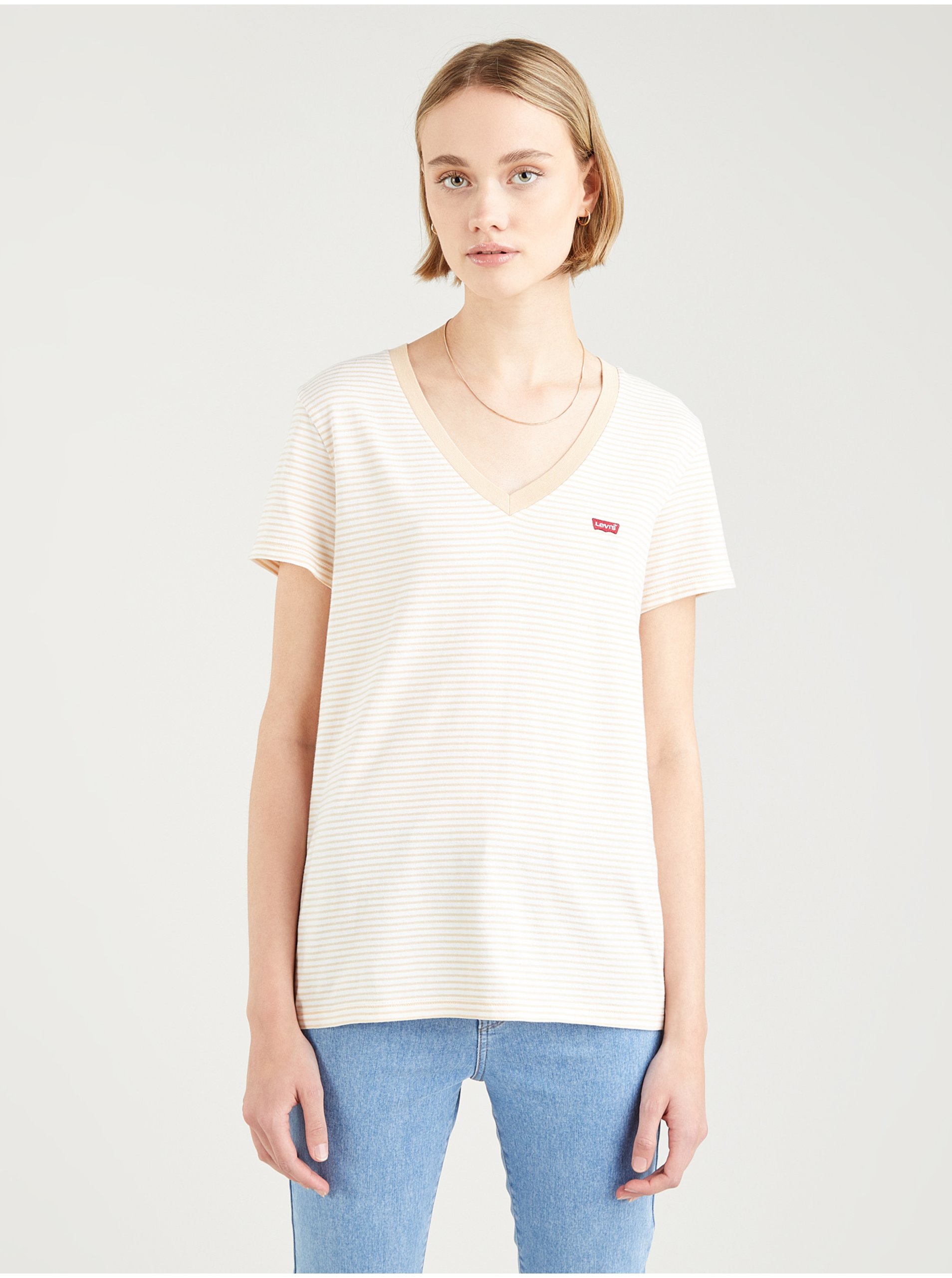 Levně Krémovo-bílé dámské pruhované tričko Levi's®