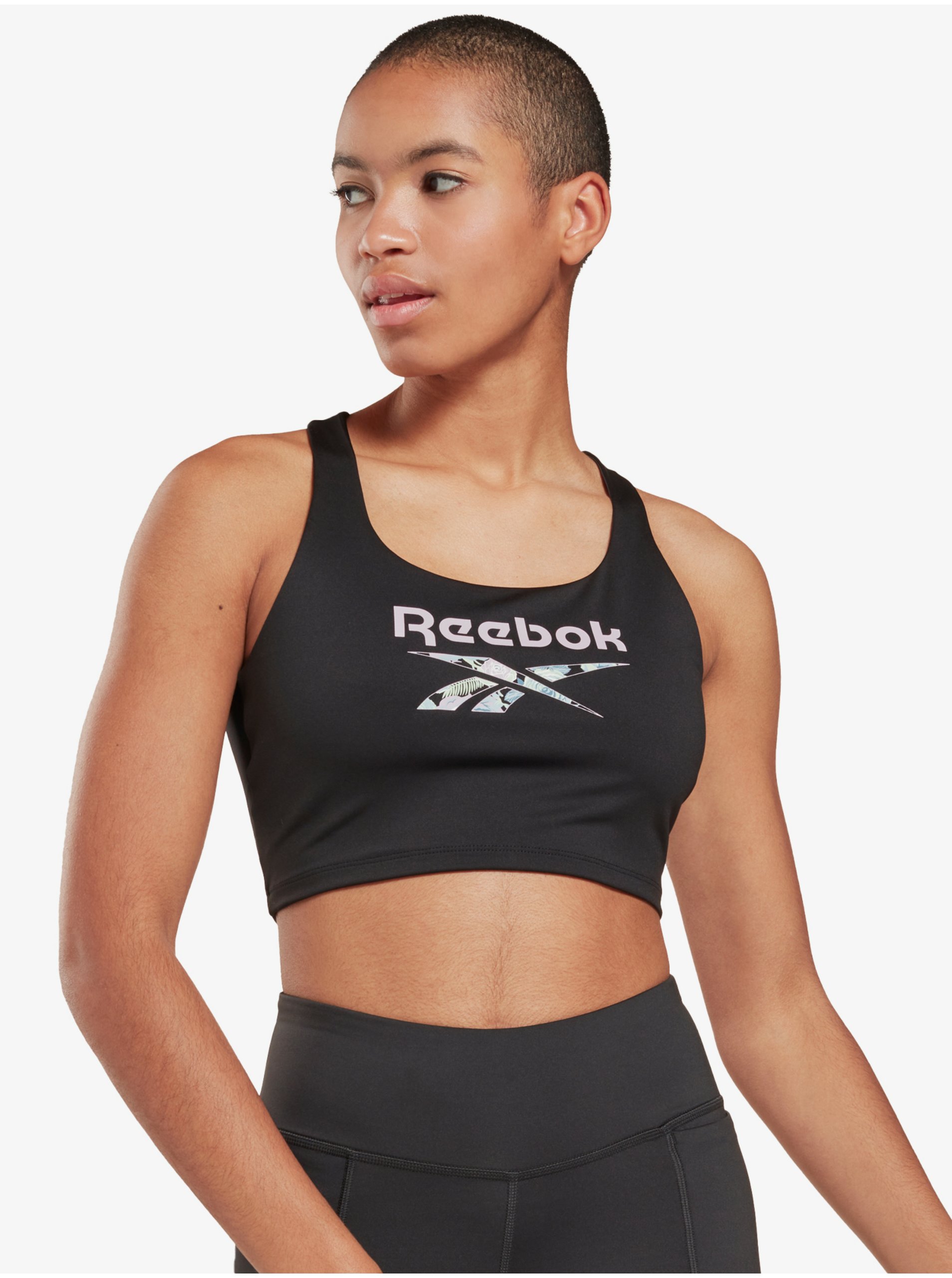 Levně Černá dámská vzorovaná sportovní podprsenka Reebok