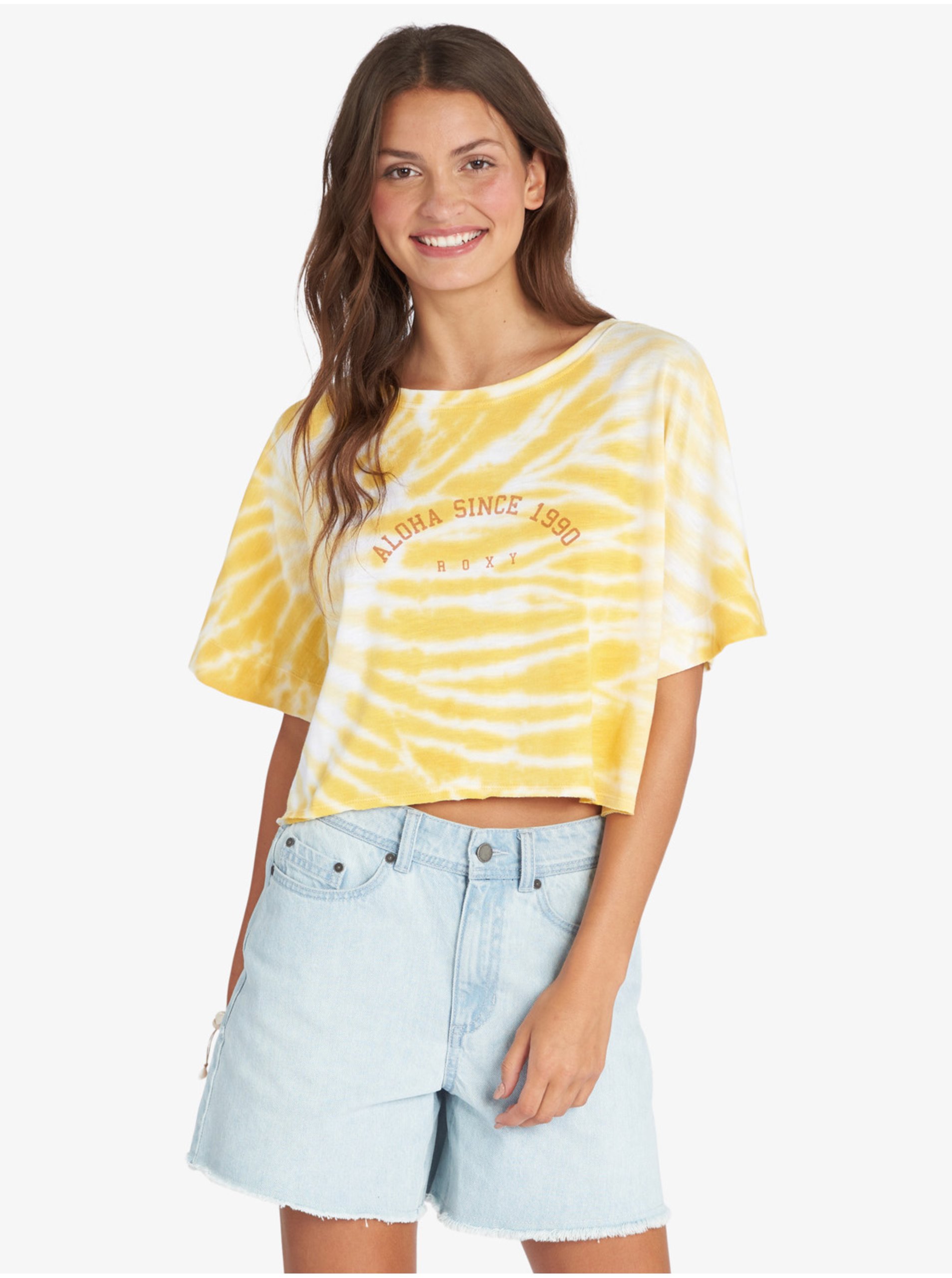 Levně Bílo-žluté dámské vzorované cropped tričko Roxy Aloha