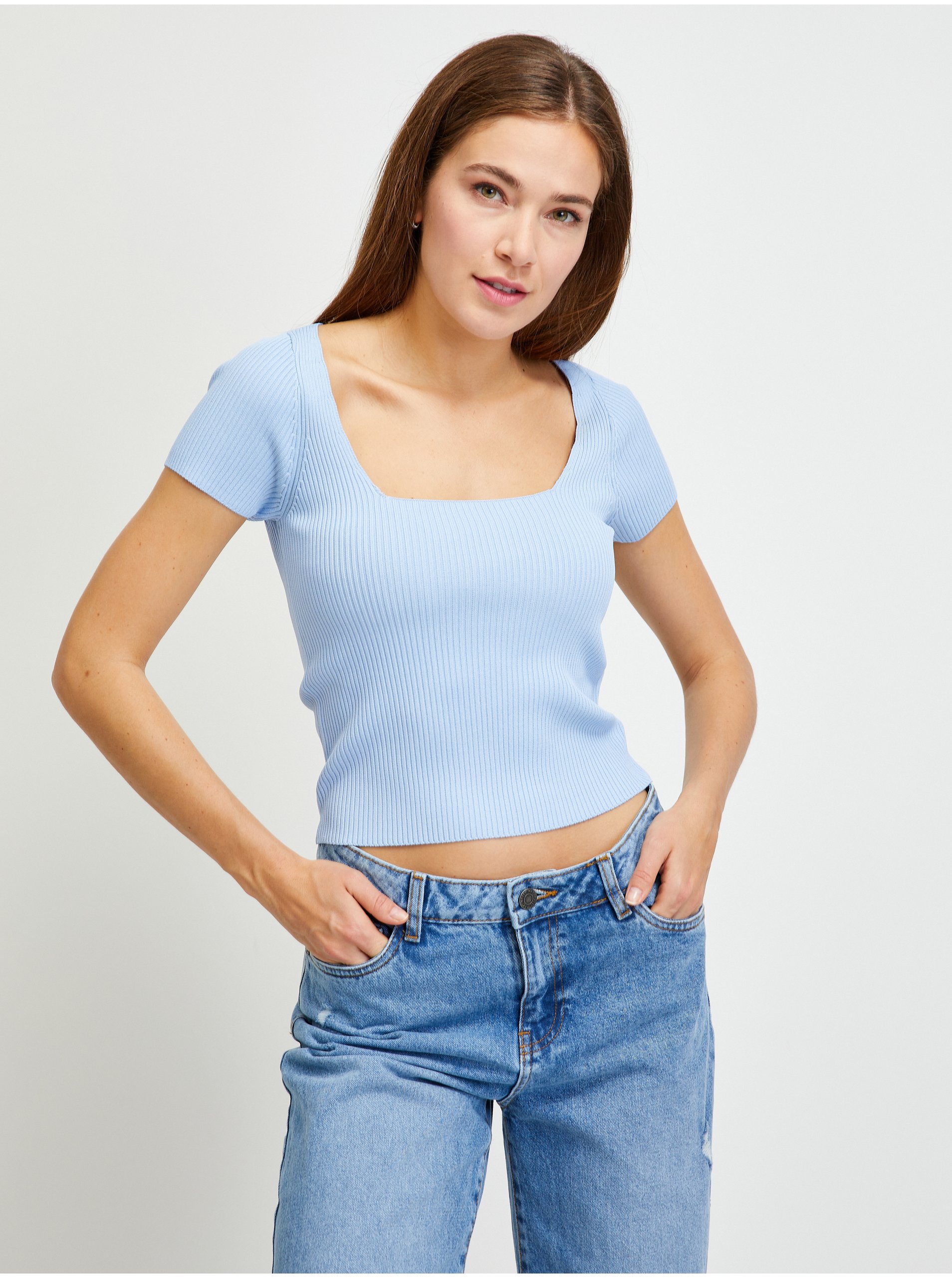 Levně Světle modré dámské žebrované cropped tričko Guess