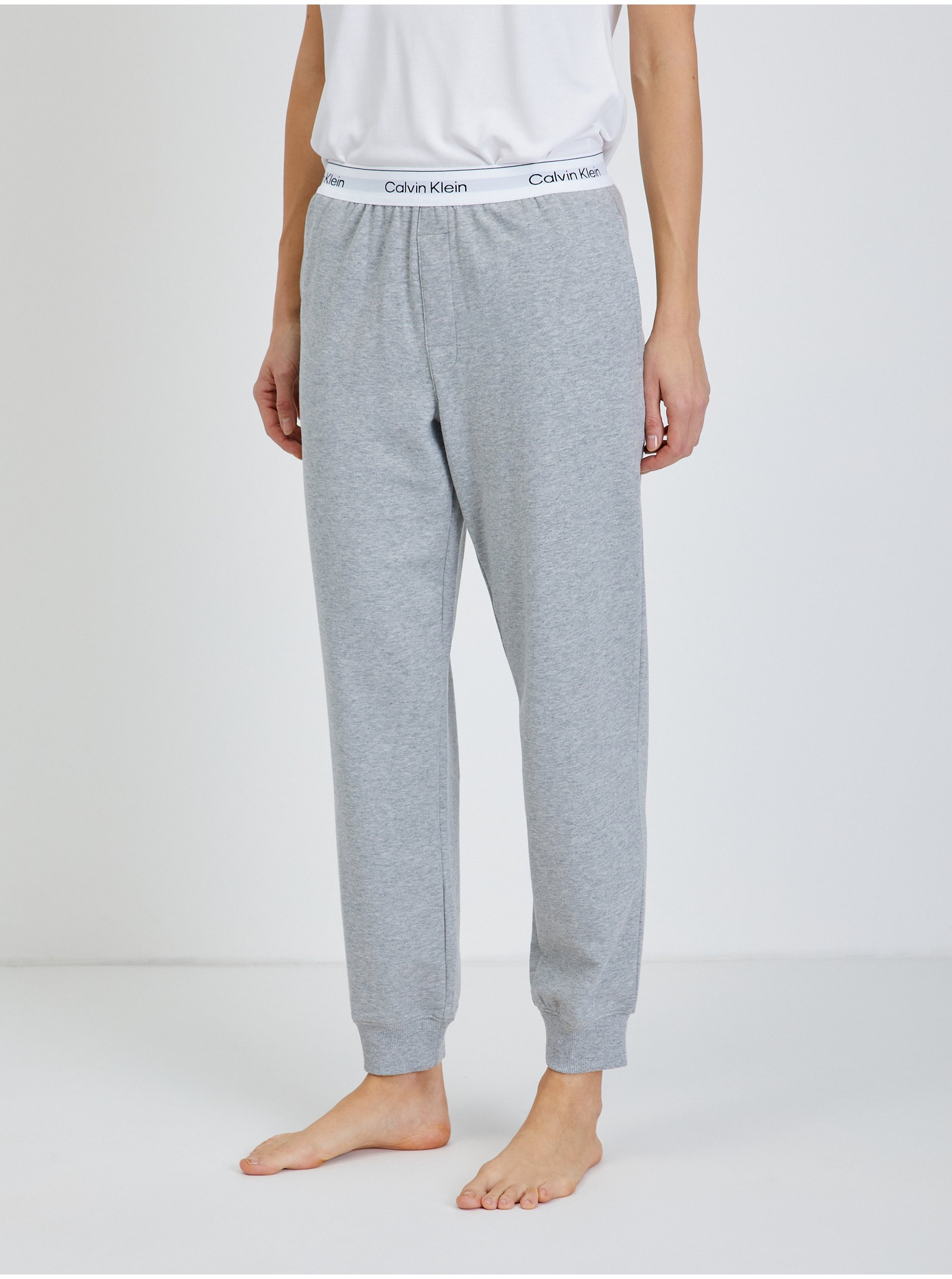 Levně Světle šedé dámské žíhané pyžamové kalhoty Calvin Klein Underwear