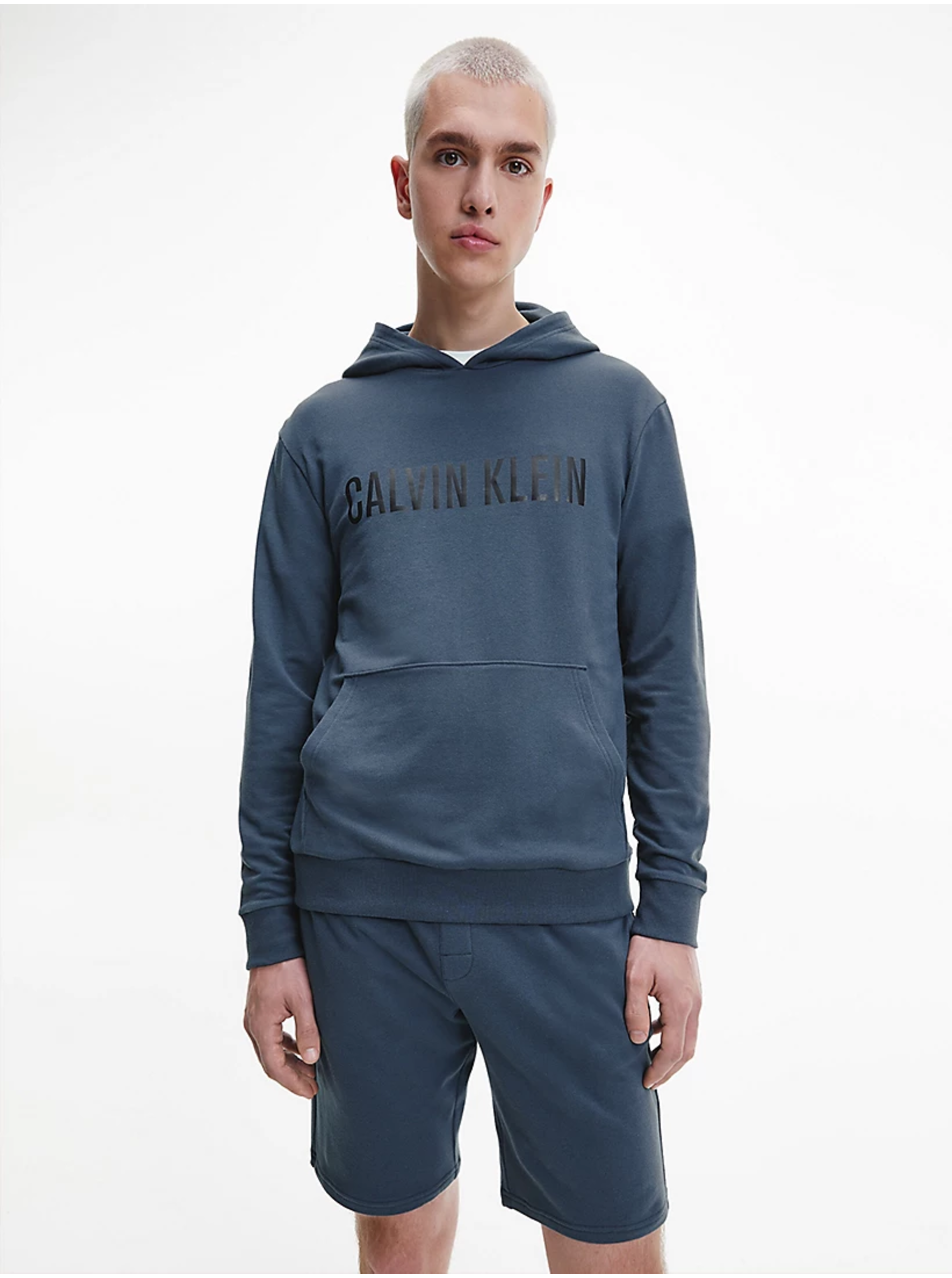 Levně Šedomodrá pánská mikina s kapucí Calvin Klein Jeans
