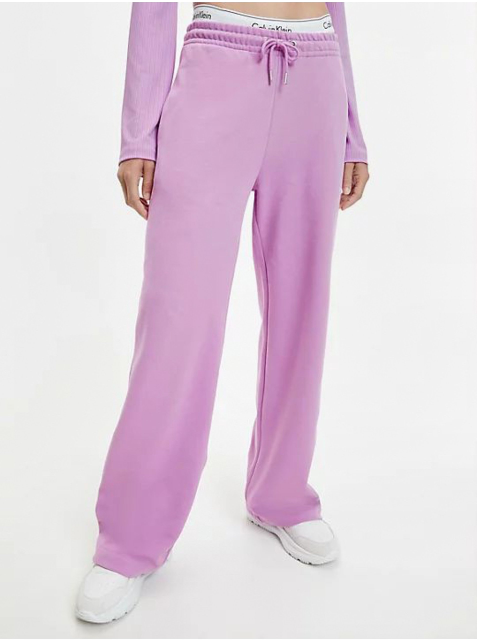 Levně Světle fialové dámské tepláky Calvin Klein Jeans