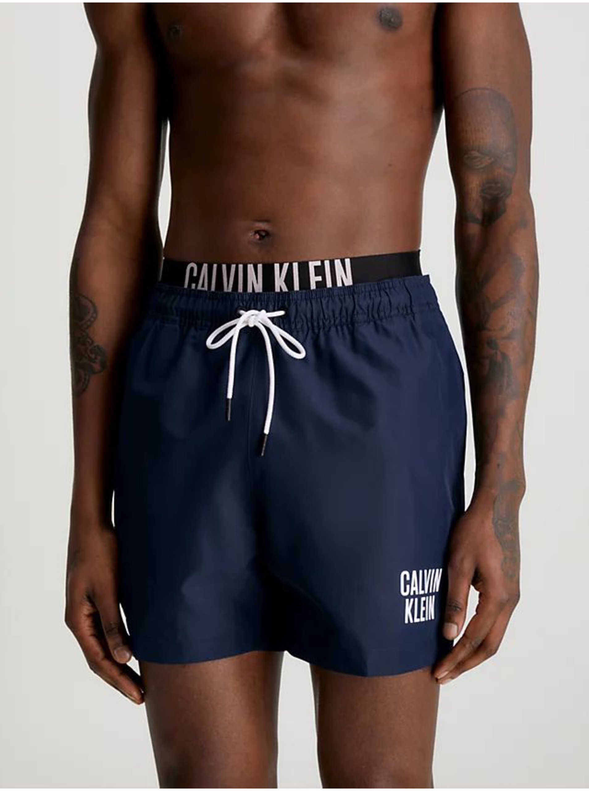 E-shop Tmavě modré pánské plavky Calvin Klein Underwear