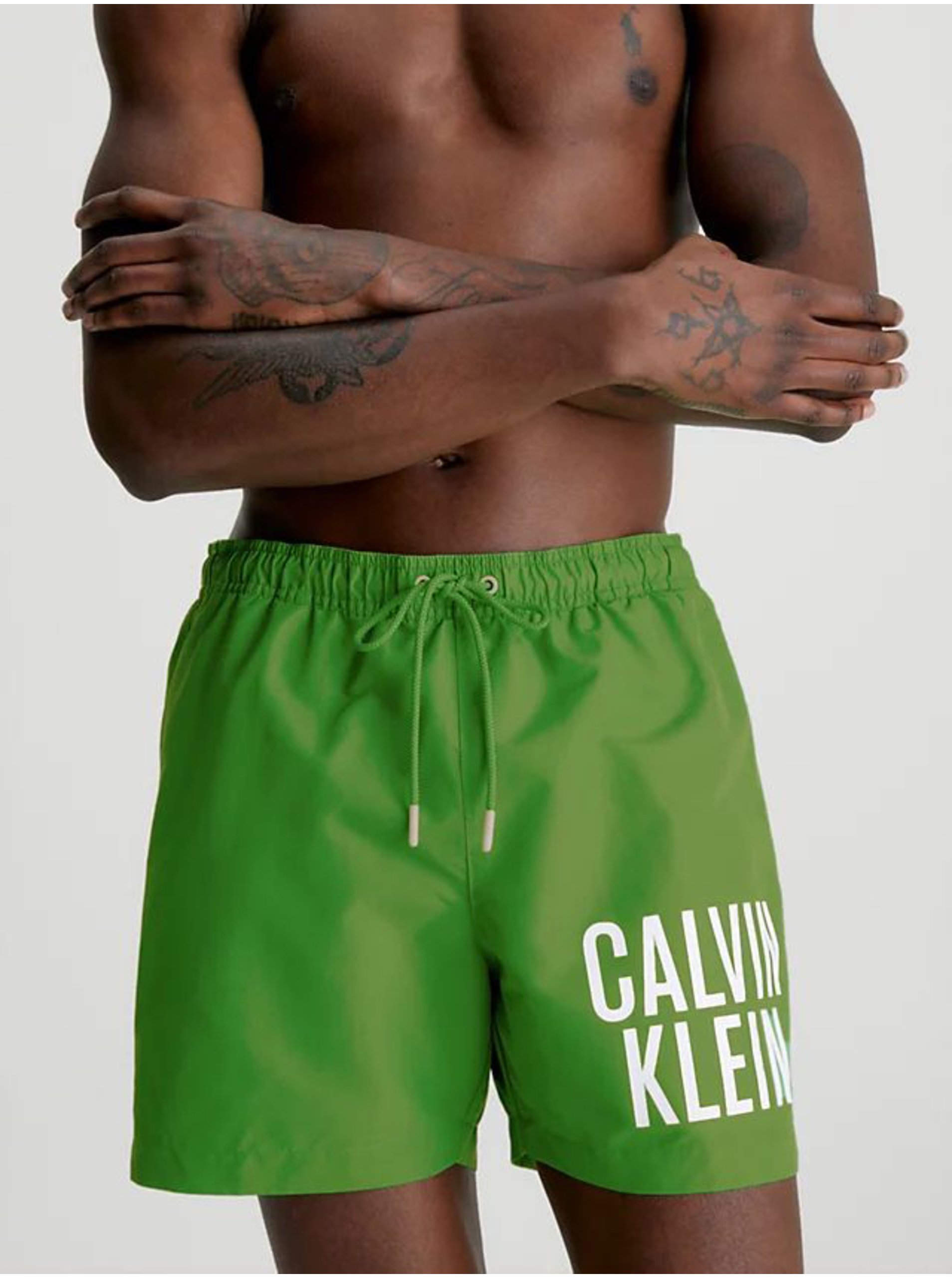 Levně Zelené pánské plavky Calvin Klein Underwear