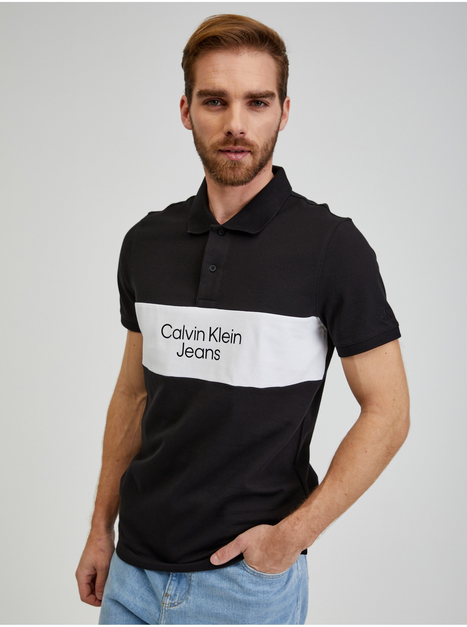 Levně Černé pánské polo tričko Calvin Klein Jeans