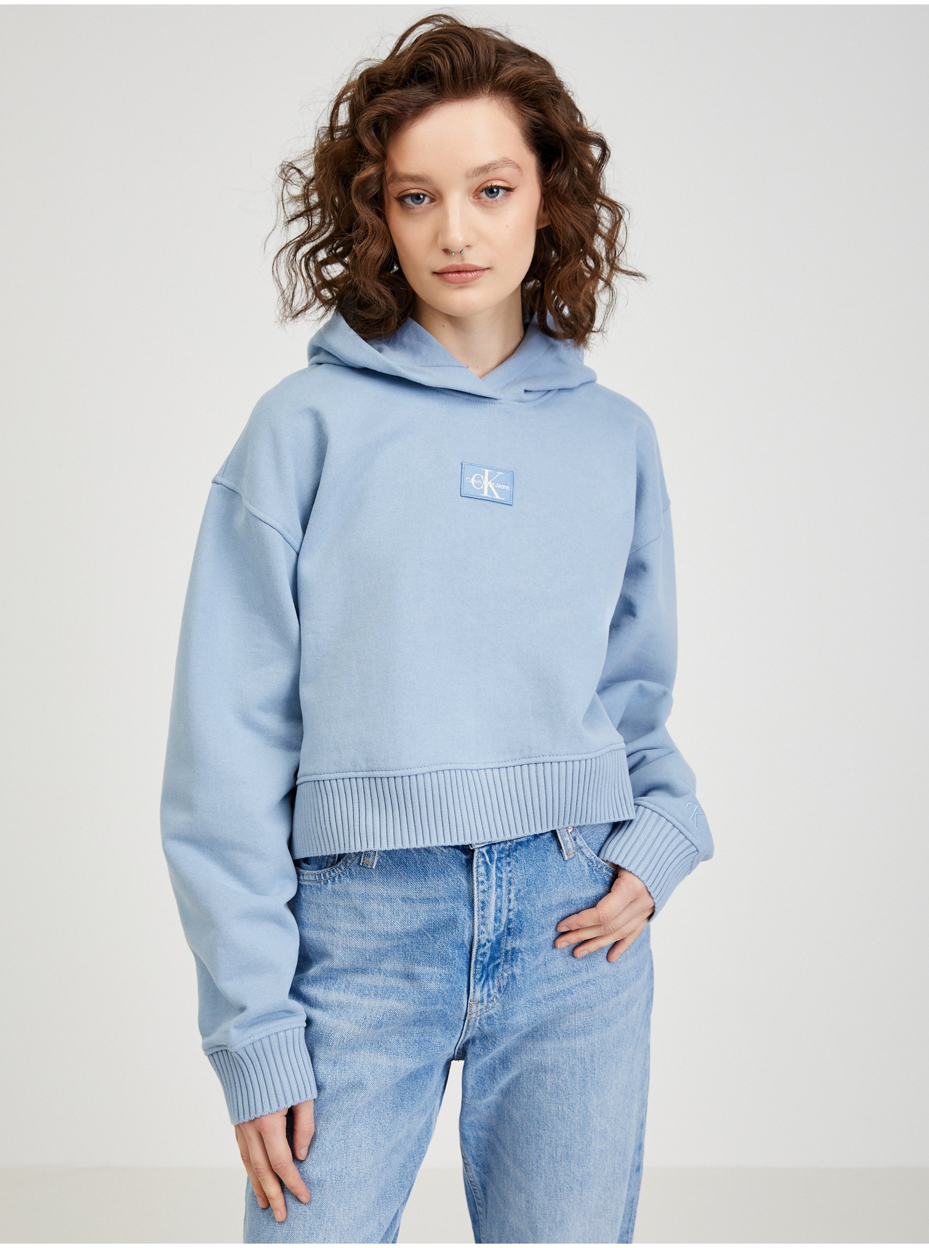 E-shop Světle modrá dámská mikina s kapucí Calvin Klein Jeans