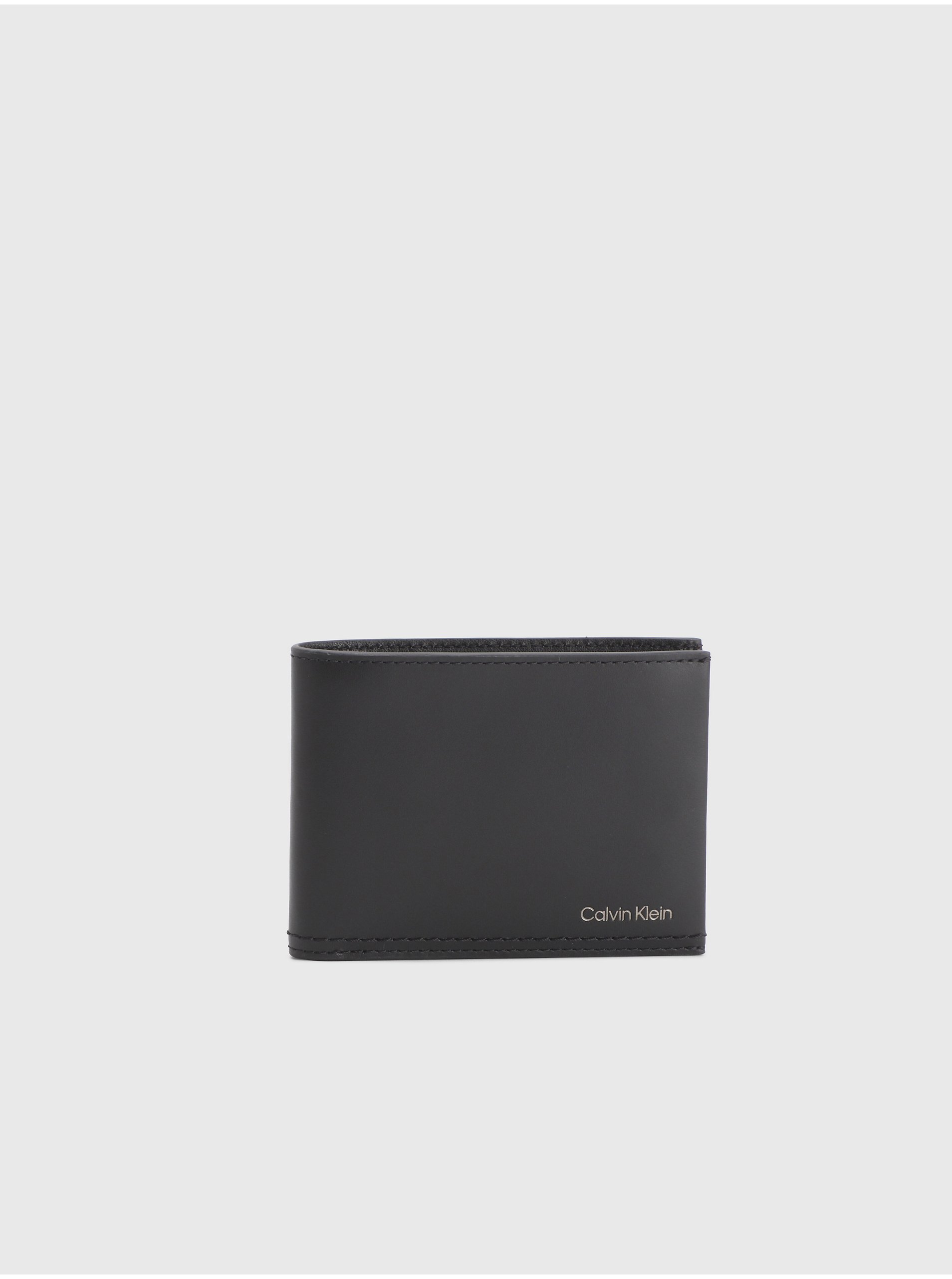Levně Černá pánská kožená peněženka Calvin Klein