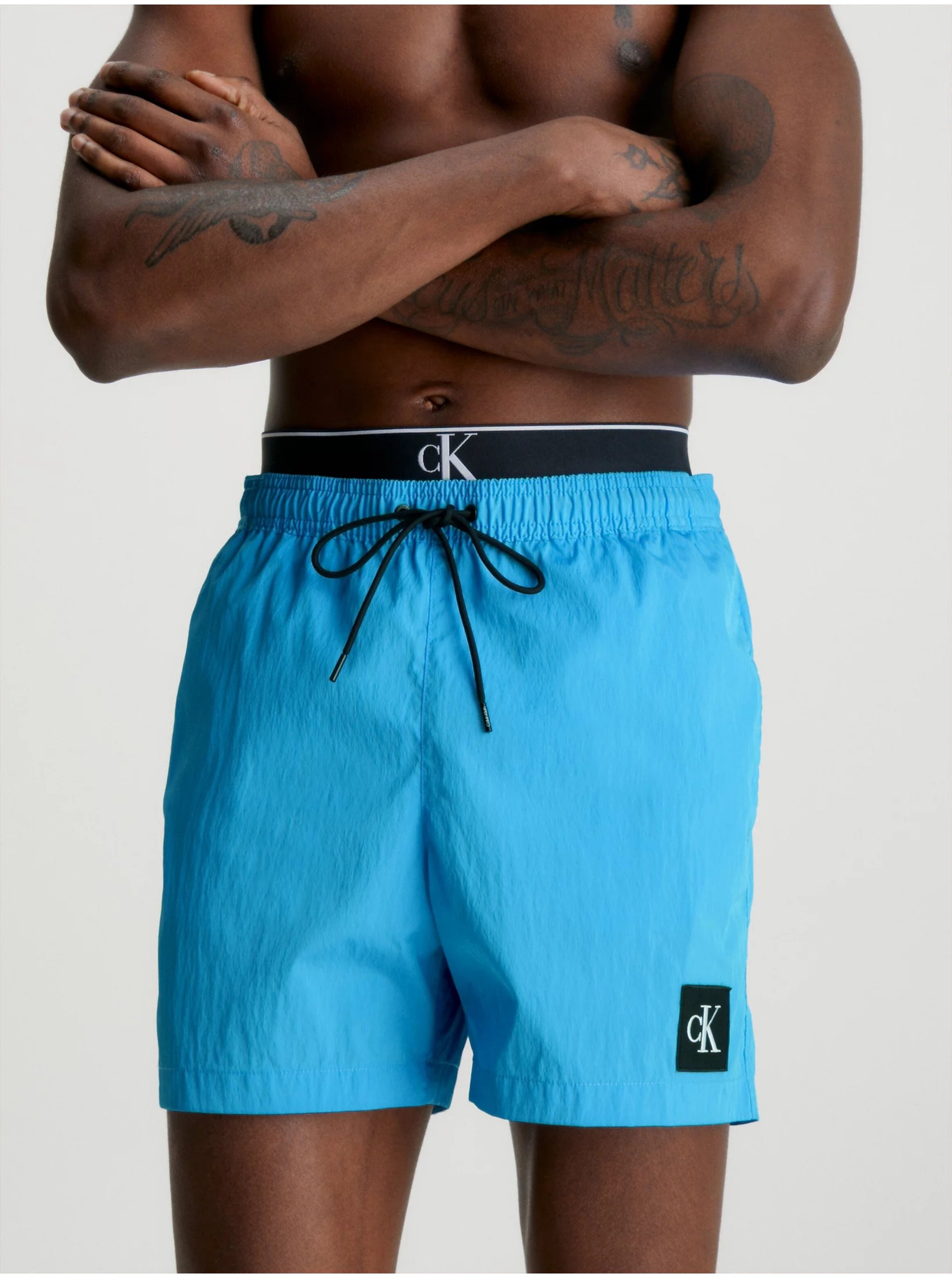 E-shop Modré pánské plavky Calvin Klein Underwear
