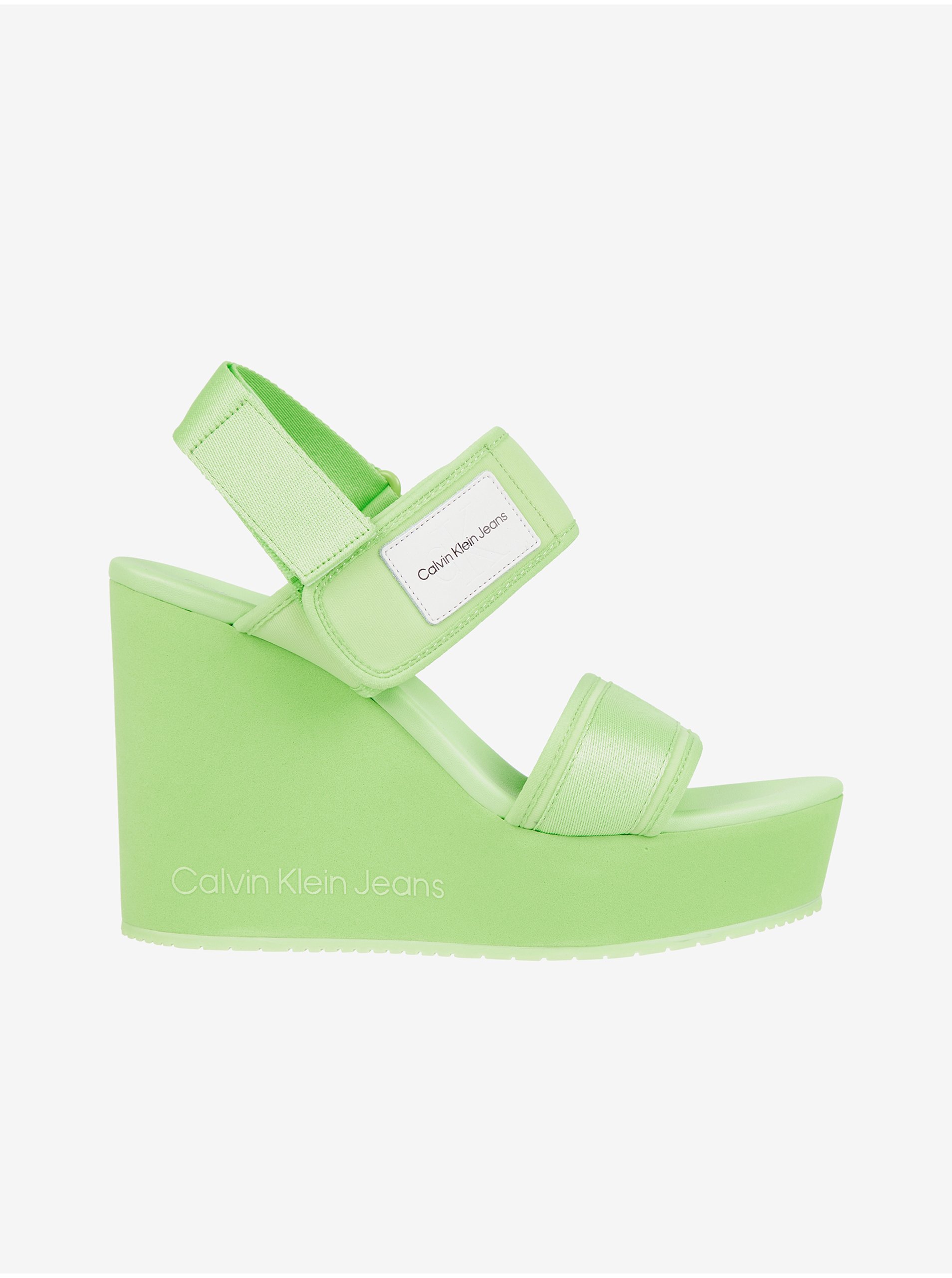 Levně Světle zelené dámské sandály na klínku Calvin Klein Jeans