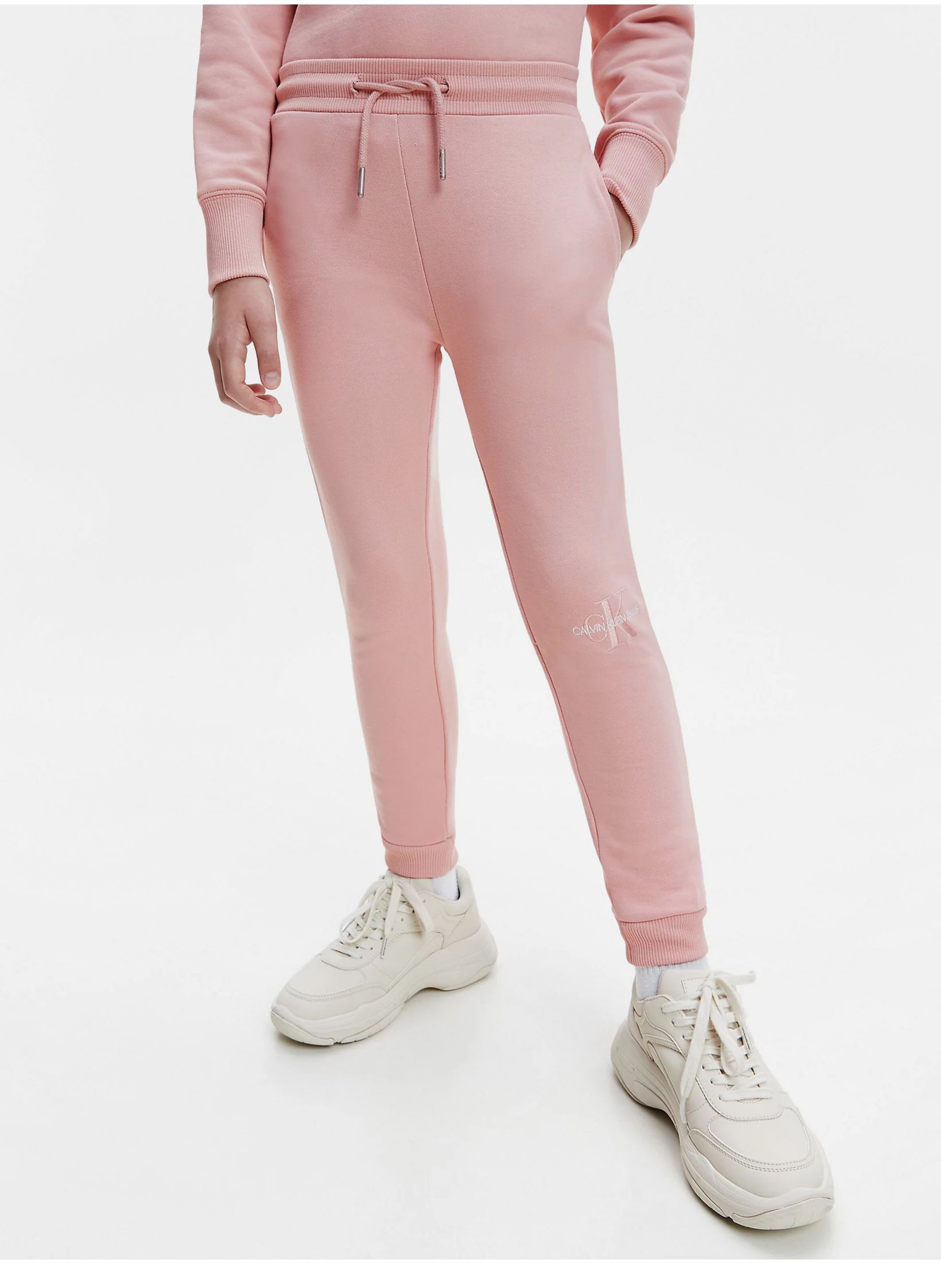 Levně Růžové holčičí tepláky Calvin Klein Jeans