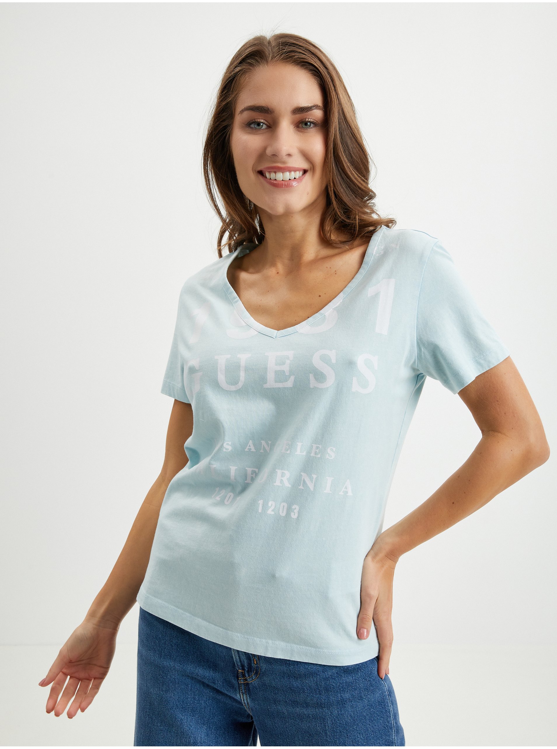 Levně Světle modré dámské tričko Guess
