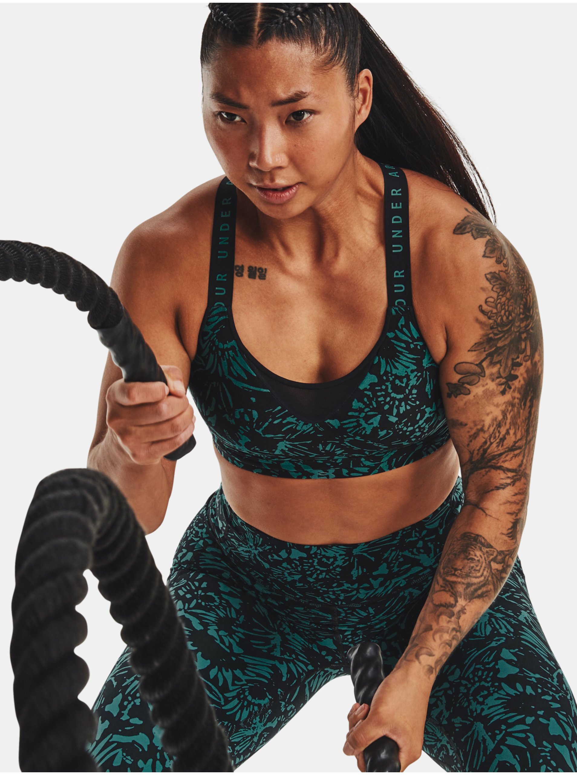 E-shop Zeleno-černá dámská vzorovaná sportovní podprsenka Under Armour UA Infinity High Print Bra