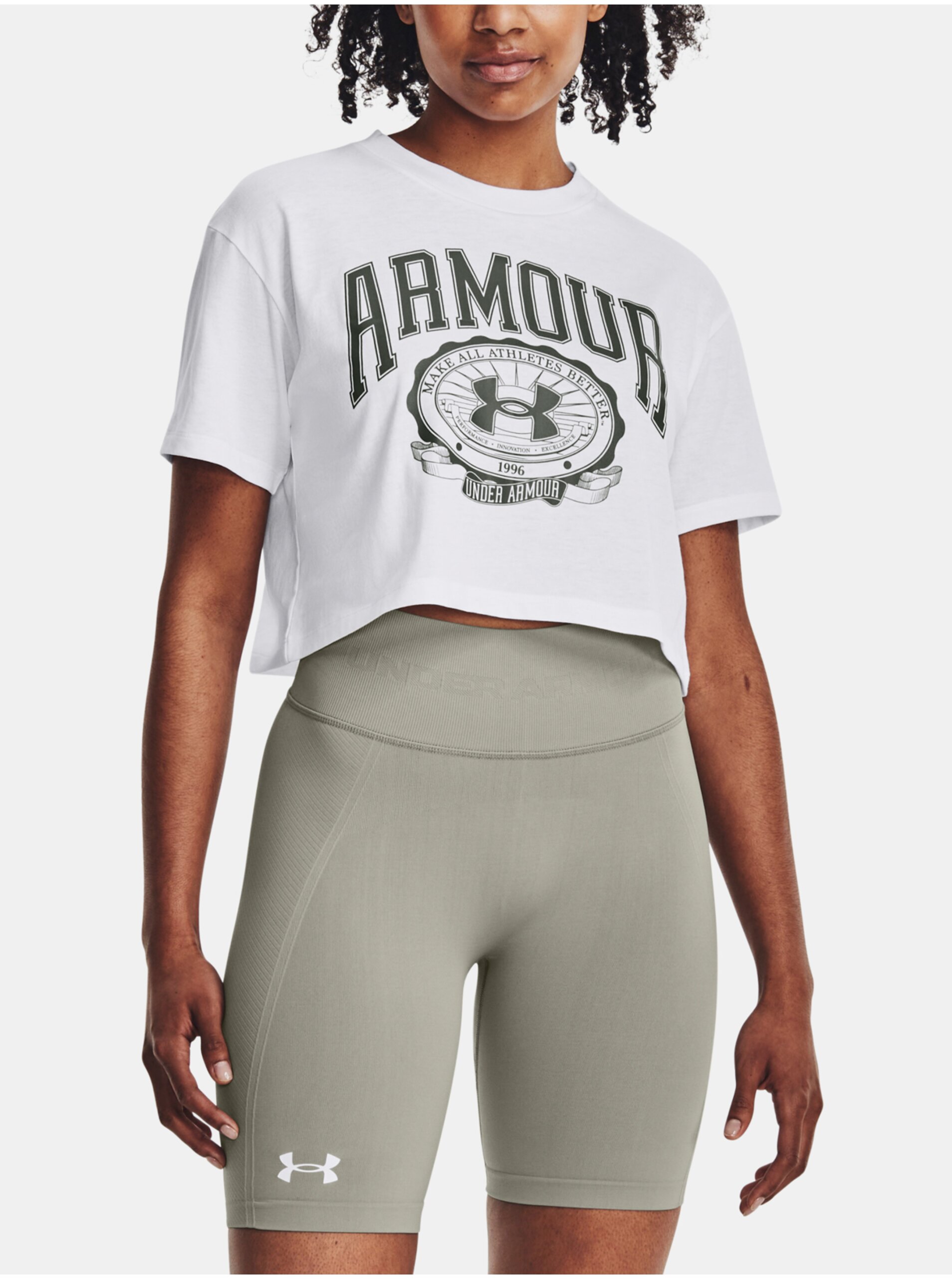 Levně Bílé dámské sportovní cro top tričko Under Armour Collegiate