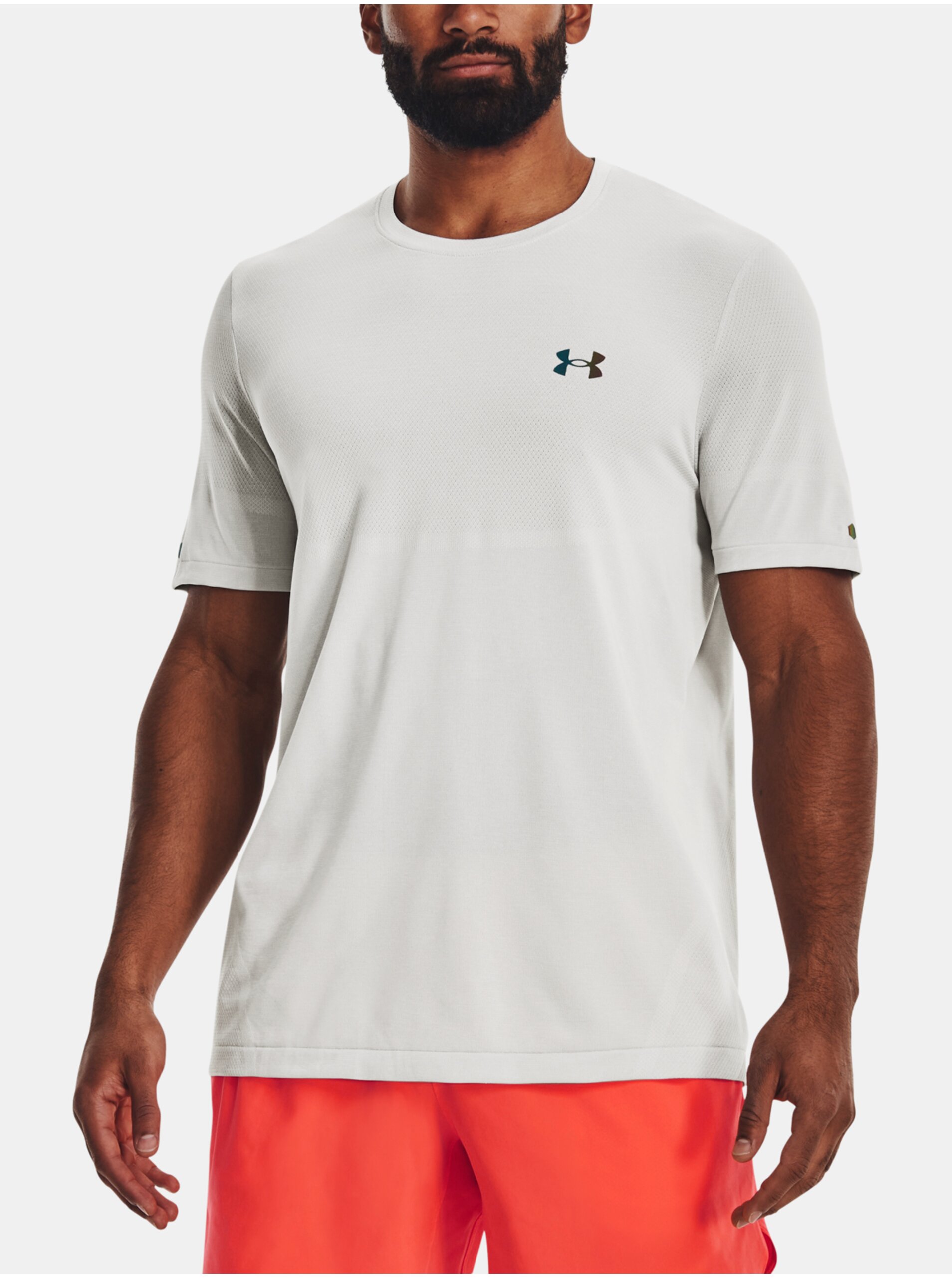 Levně Bílé sportovní tričko Under Armour UA Rush Seamless Legacy SS