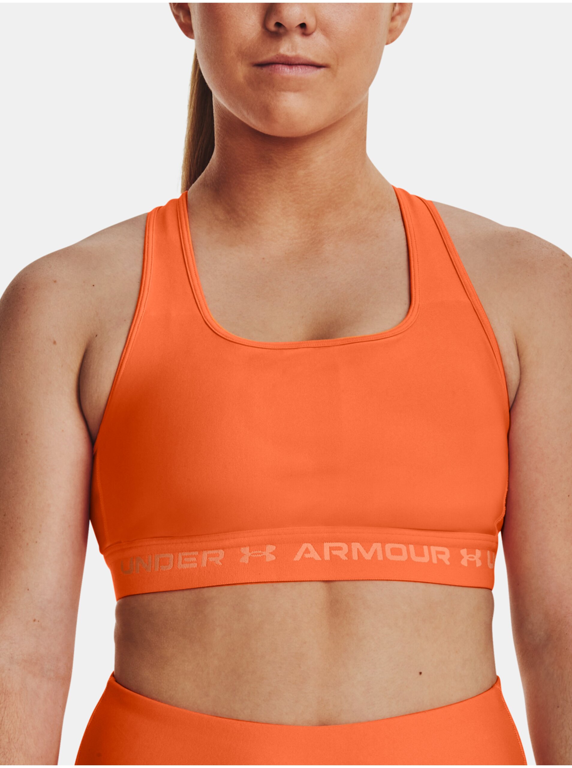 E-shop Oranžová sportovní podprsenka Under Armour UA Crossback Mid Bra