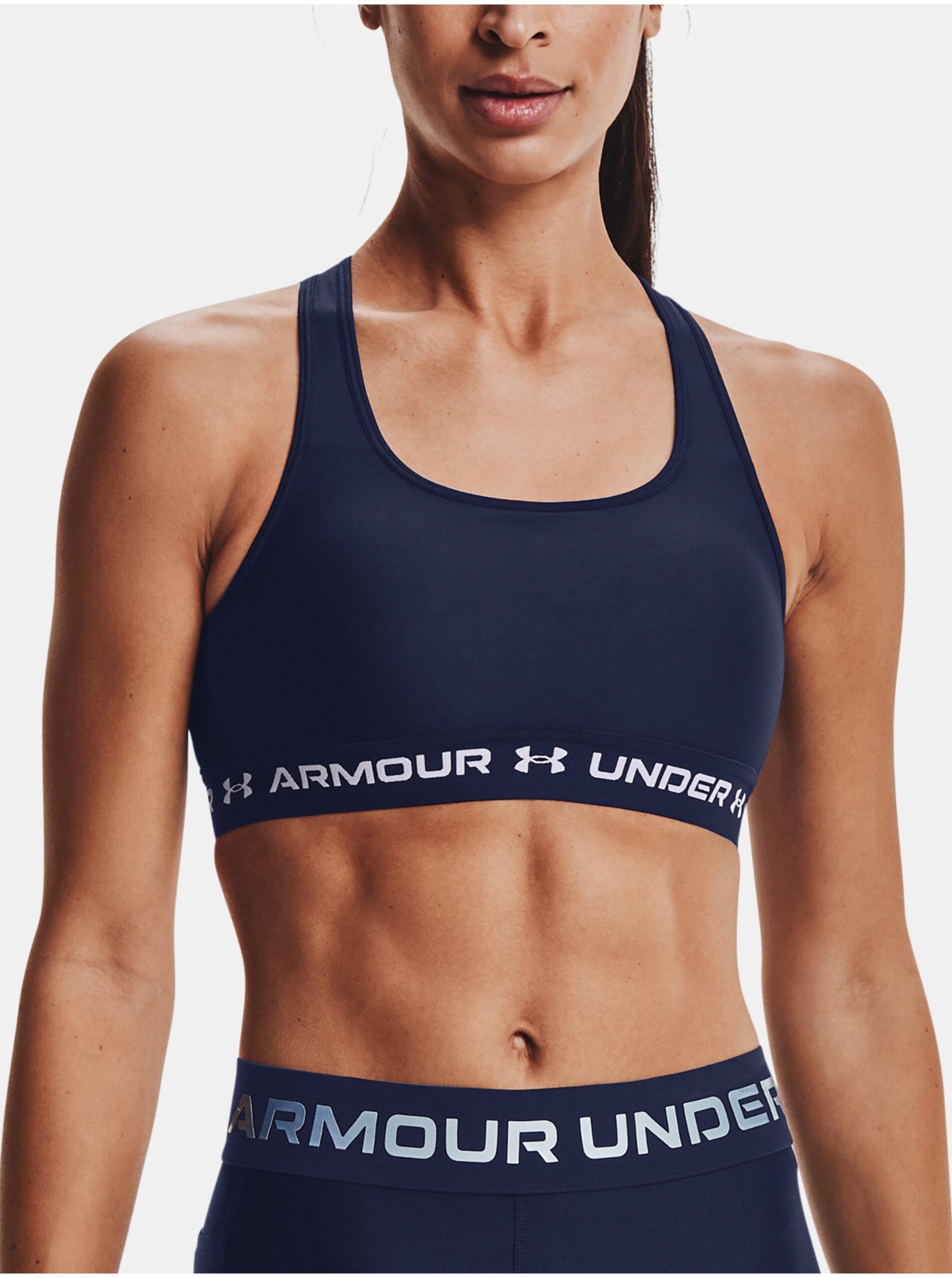Levně Tmavě modrá dámská sportovní podprsenka Under Armour UA Crossback Mid Bra