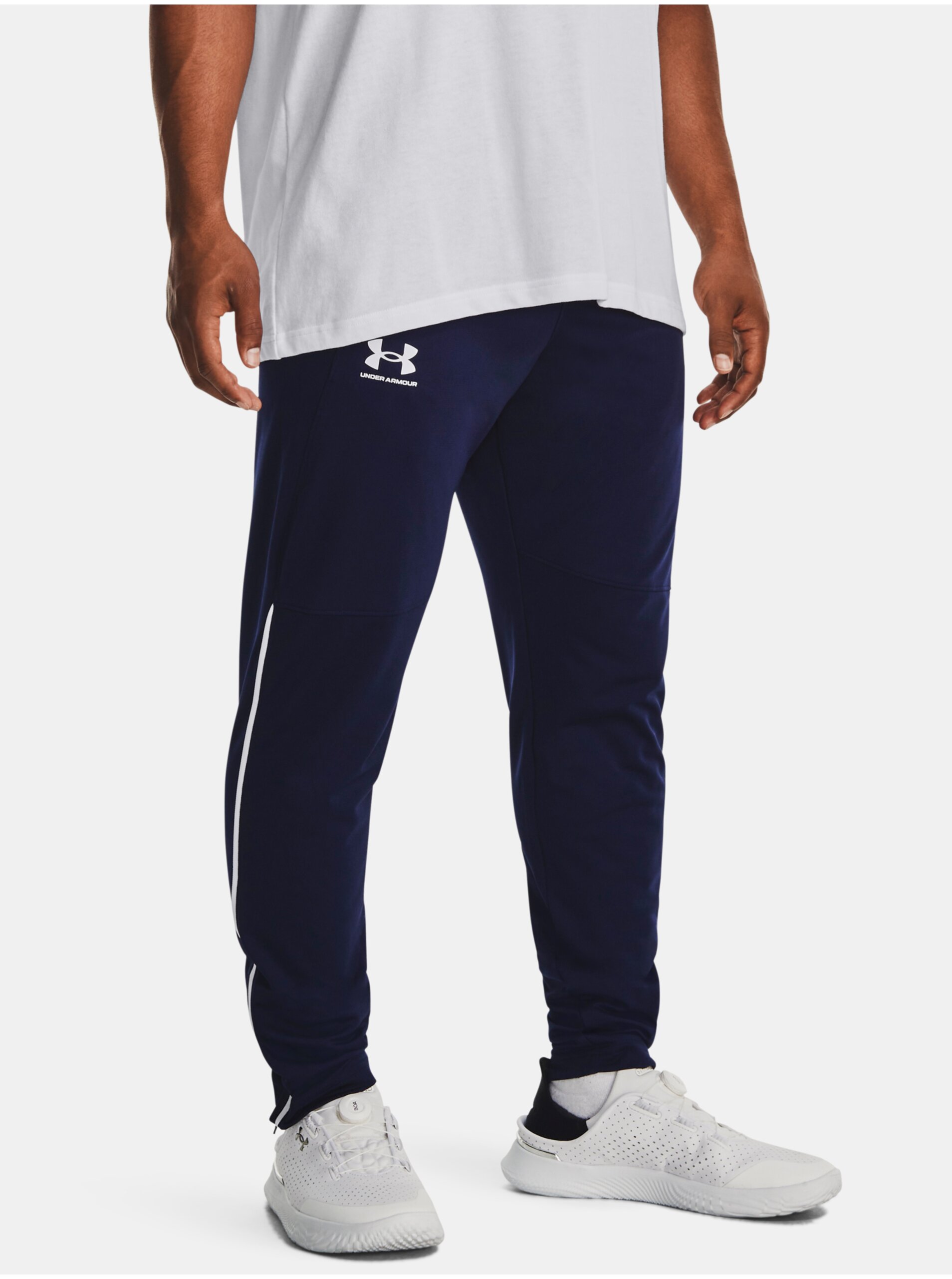 Levně Tmavě modré sportovní kalhoty Under Armour UA PIQUE TRACK PANT