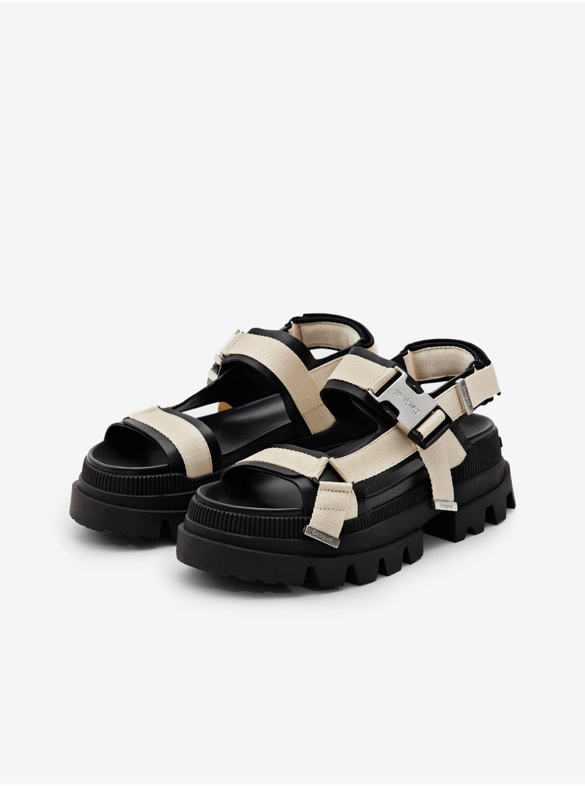 Levně Černo-béžové dámské sandály na platformě Desigual Road