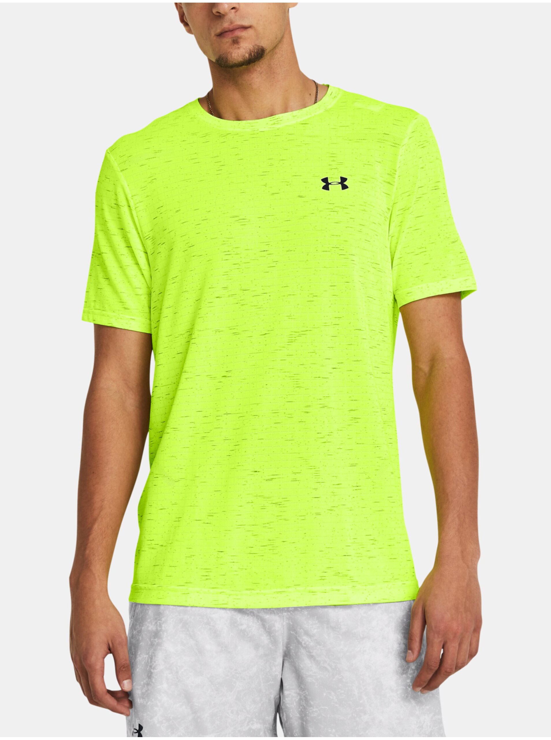 Levně Neonově zelené sportovní tričko Under Armour UA Seamless Grid SS