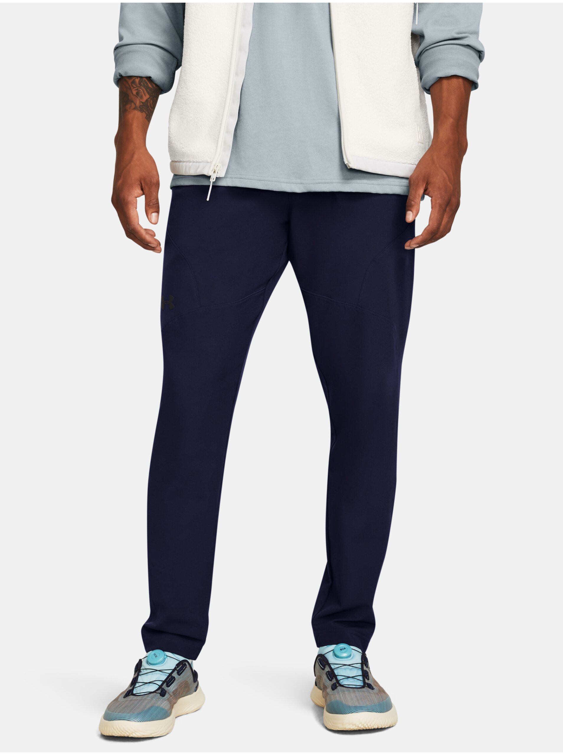 E-shop Tmavě modré sportovní kalhoty Under Armour UA UNSTOPPABLE TAPERED PANTS