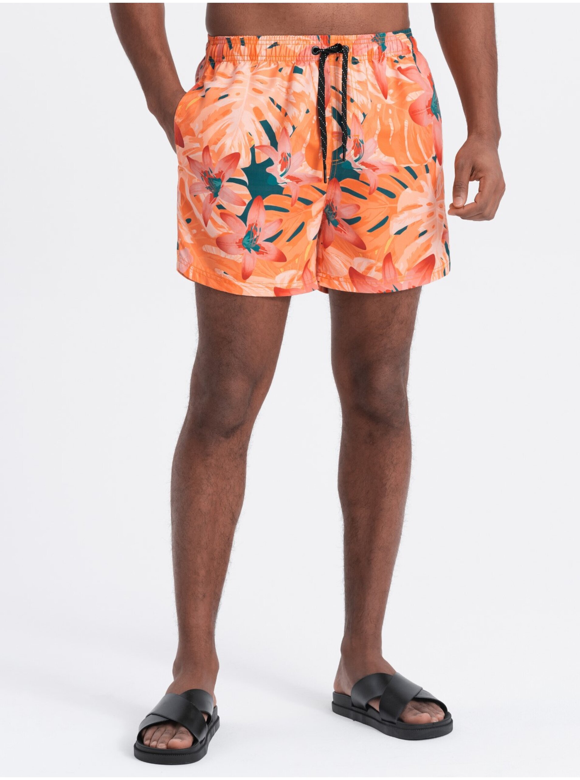 Levně Oranžové pánské květované plavky Ombre Clothing