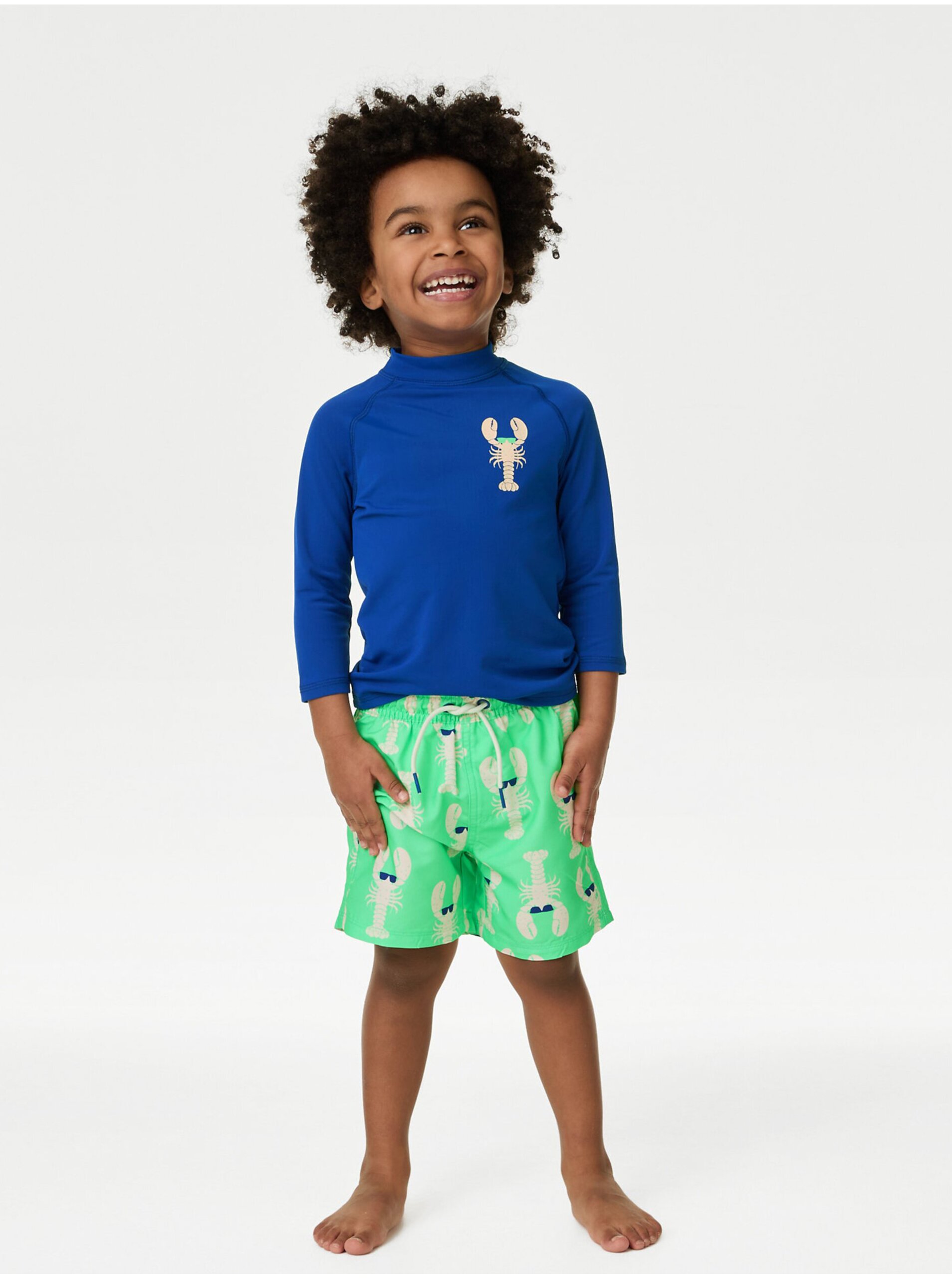Levně Sada klučičího plaveckého trička a kraťasů v modré a zelené barvě Marks & Spencer