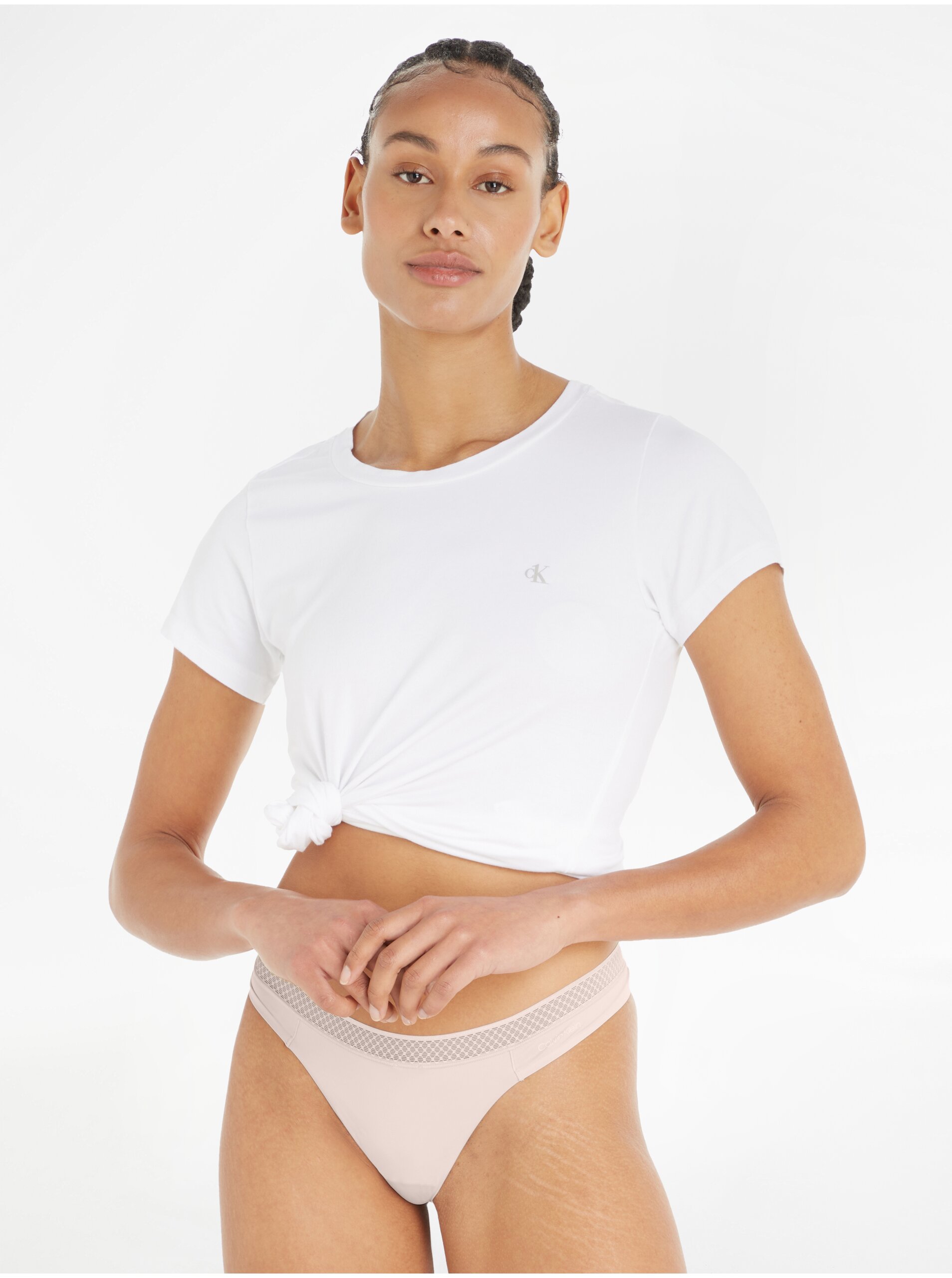 Levně Béžová dámská tanga Calvin Klein Underwear
