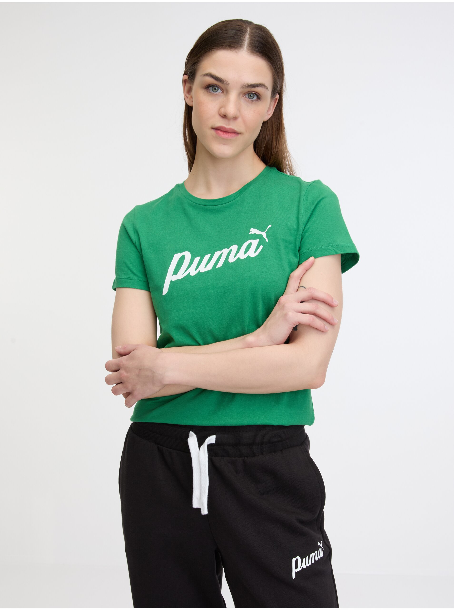 Levně Zelené dámské tričko Puma ESS+ Script Tee