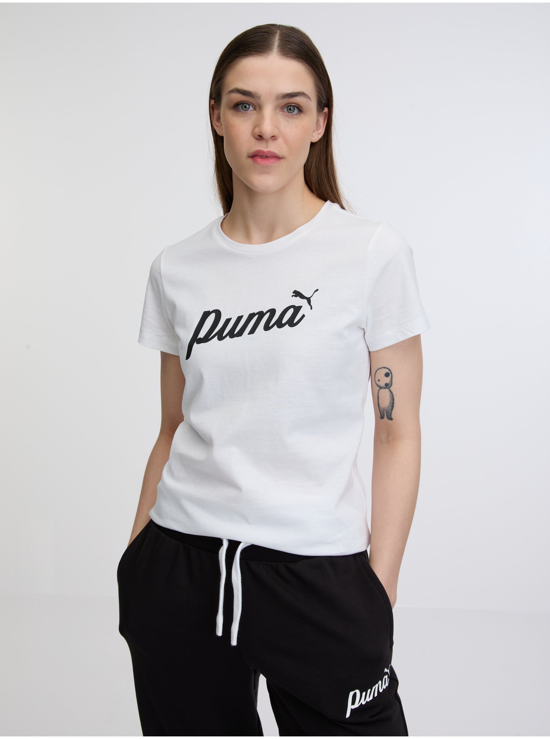 Levně Bílé dámské tričko Puma ESS+ Script Tee